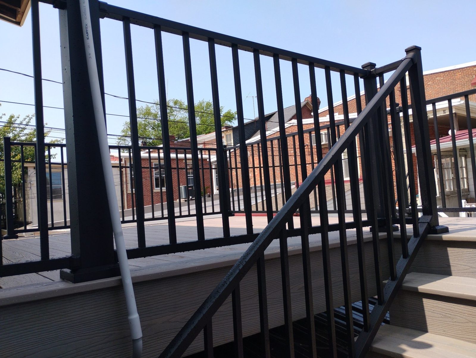 Black metal railing detail on completed deck