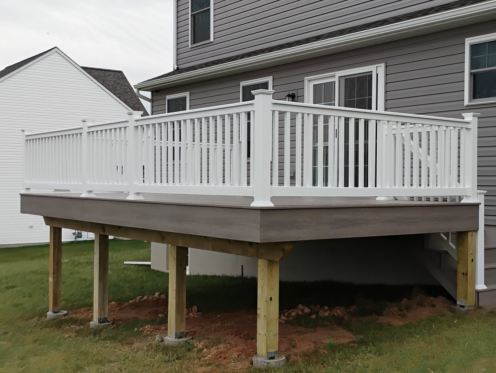 Completed raised deck with white railing