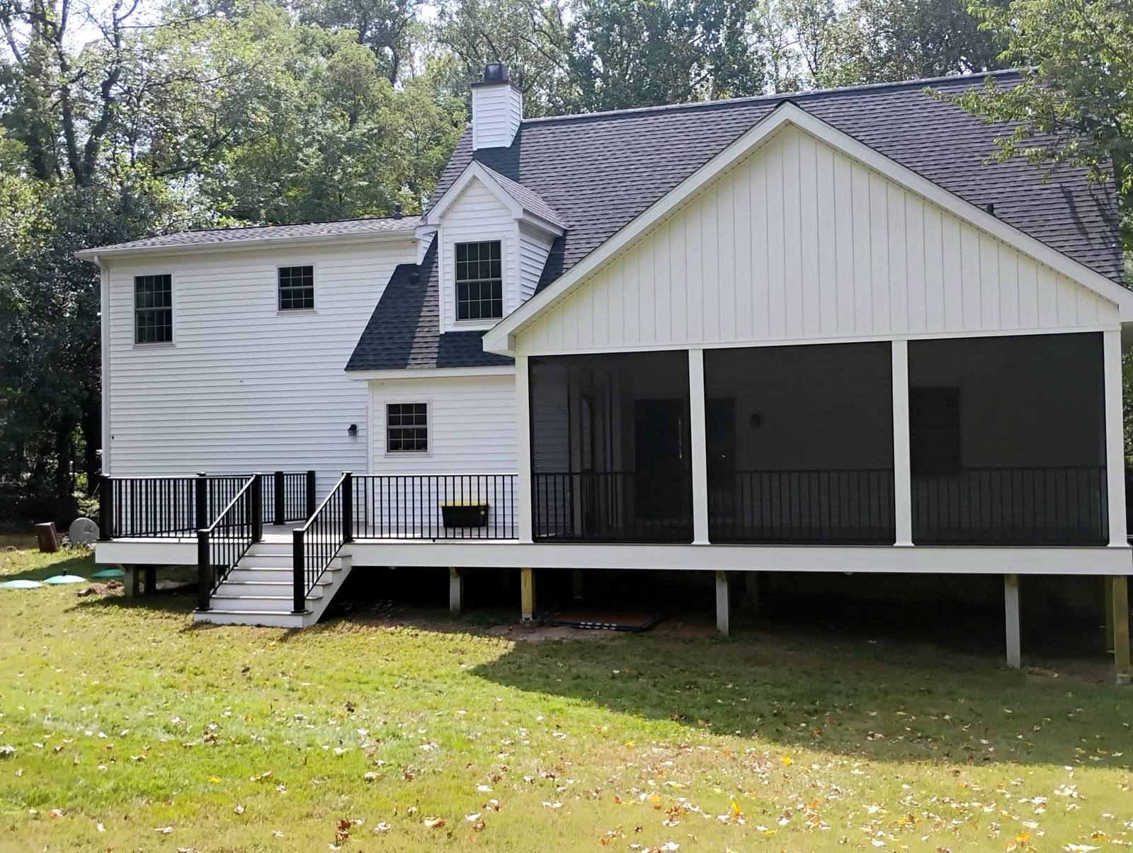 Screened porch addition on a two-story home