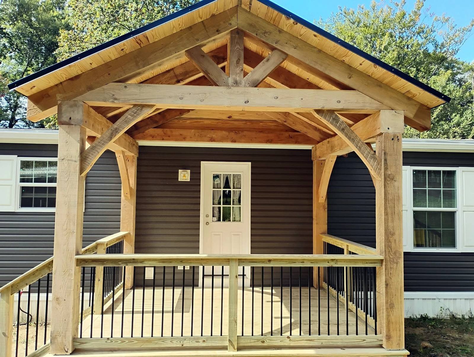 Finished timber front porch with broad steps