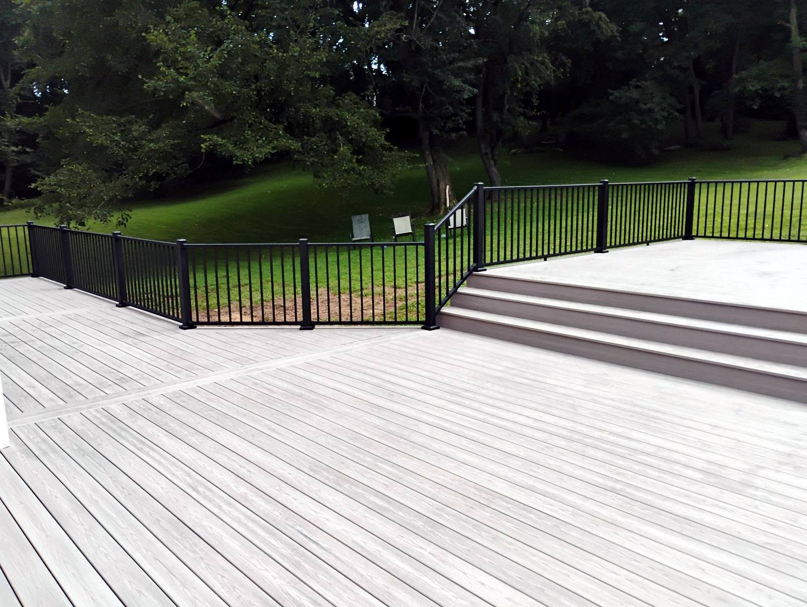 Finished residential exterior project with landscaped lawn