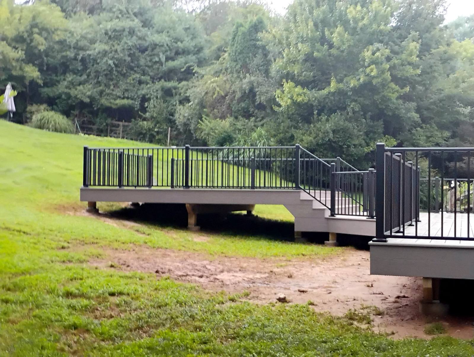 Finished residential construction beside a green lawn