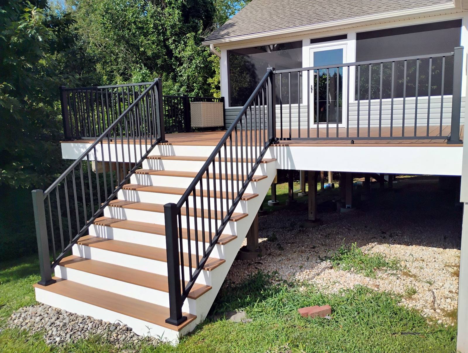 Completed exterior construction with broad lawn