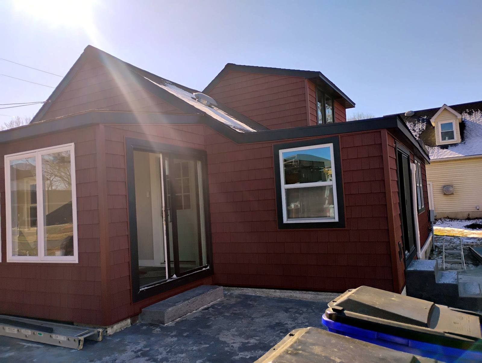 Completed sunroom addition with tall windows