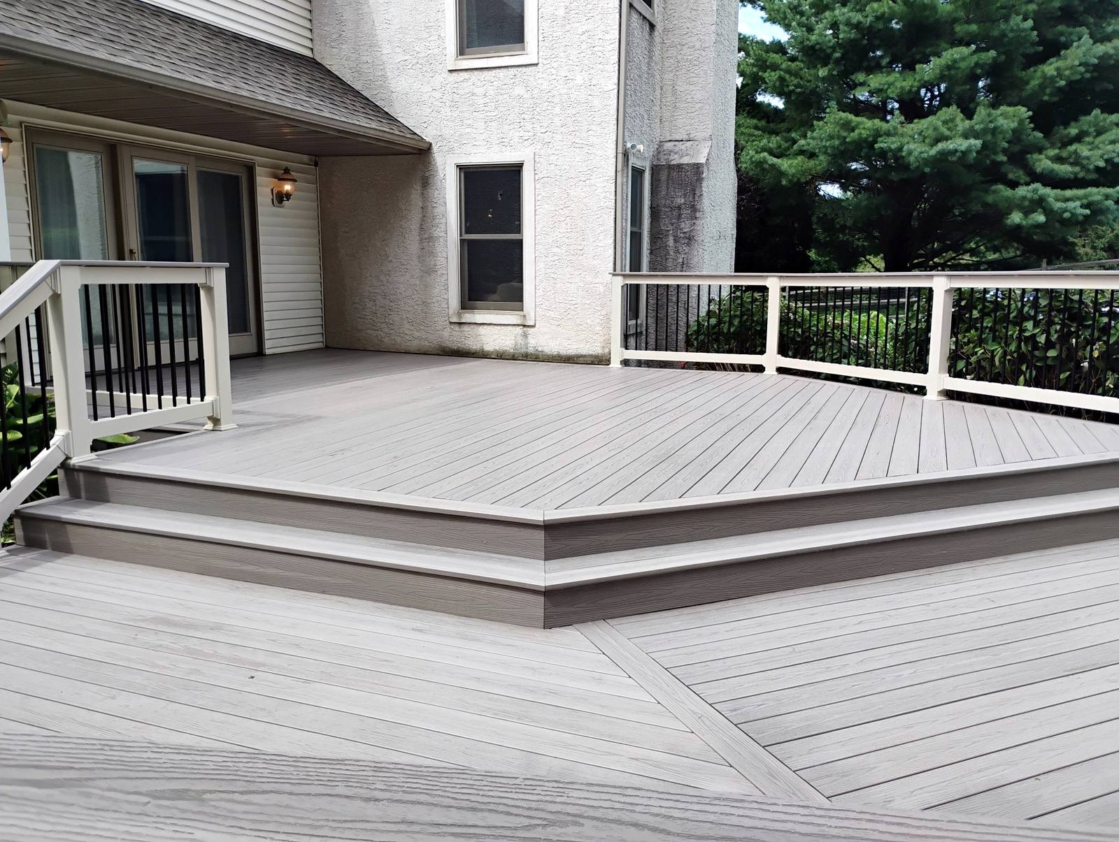 Gray composite deck with white and black railings