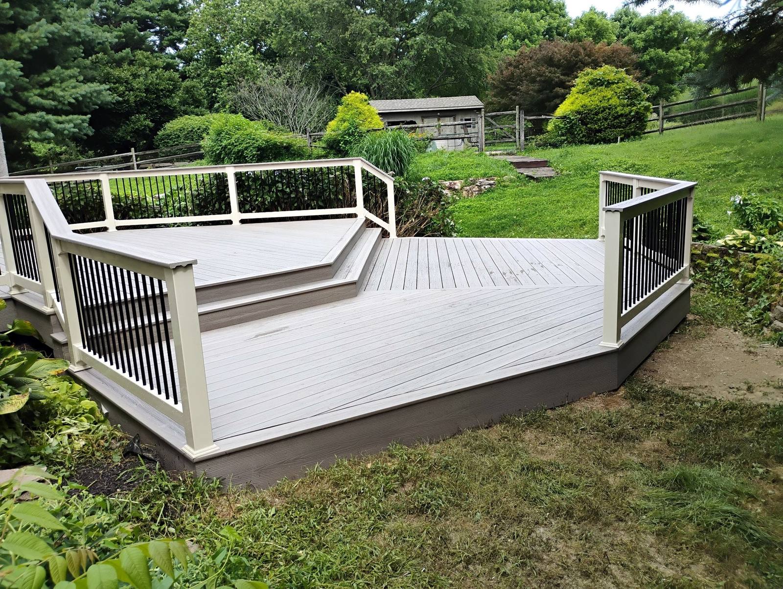 Wide gray platform deck with dark balusters