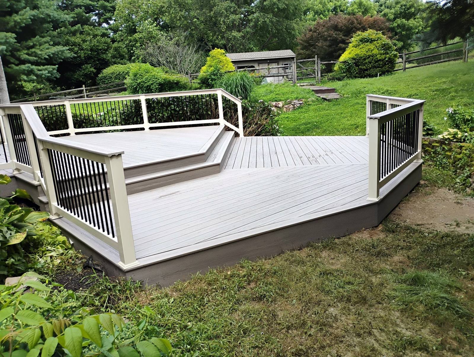 Completed gray platform deck overlooking the garden