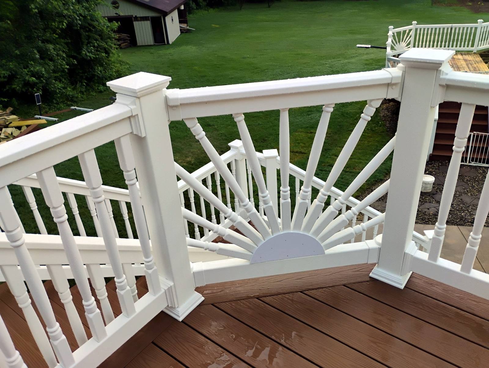 Brown composite deck with white sunburst railings