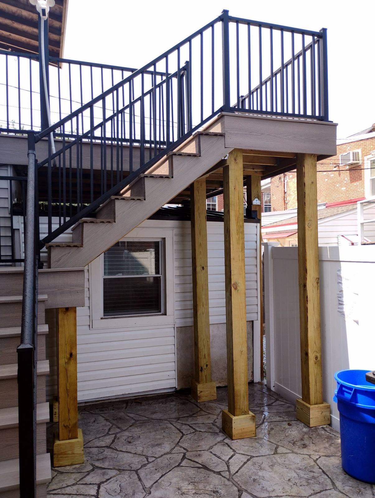 Raised deck staircase with finished lower landing