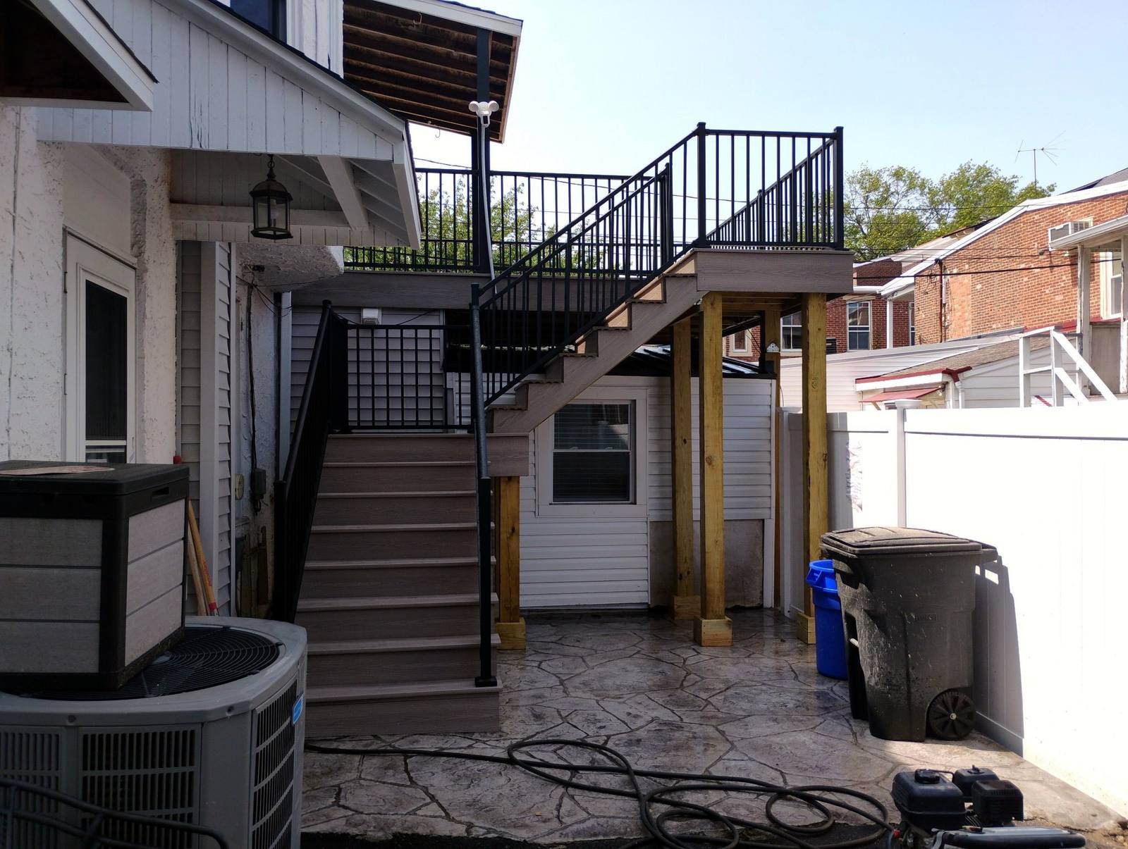 Completed exterior stairs and upper deck on a two-story home