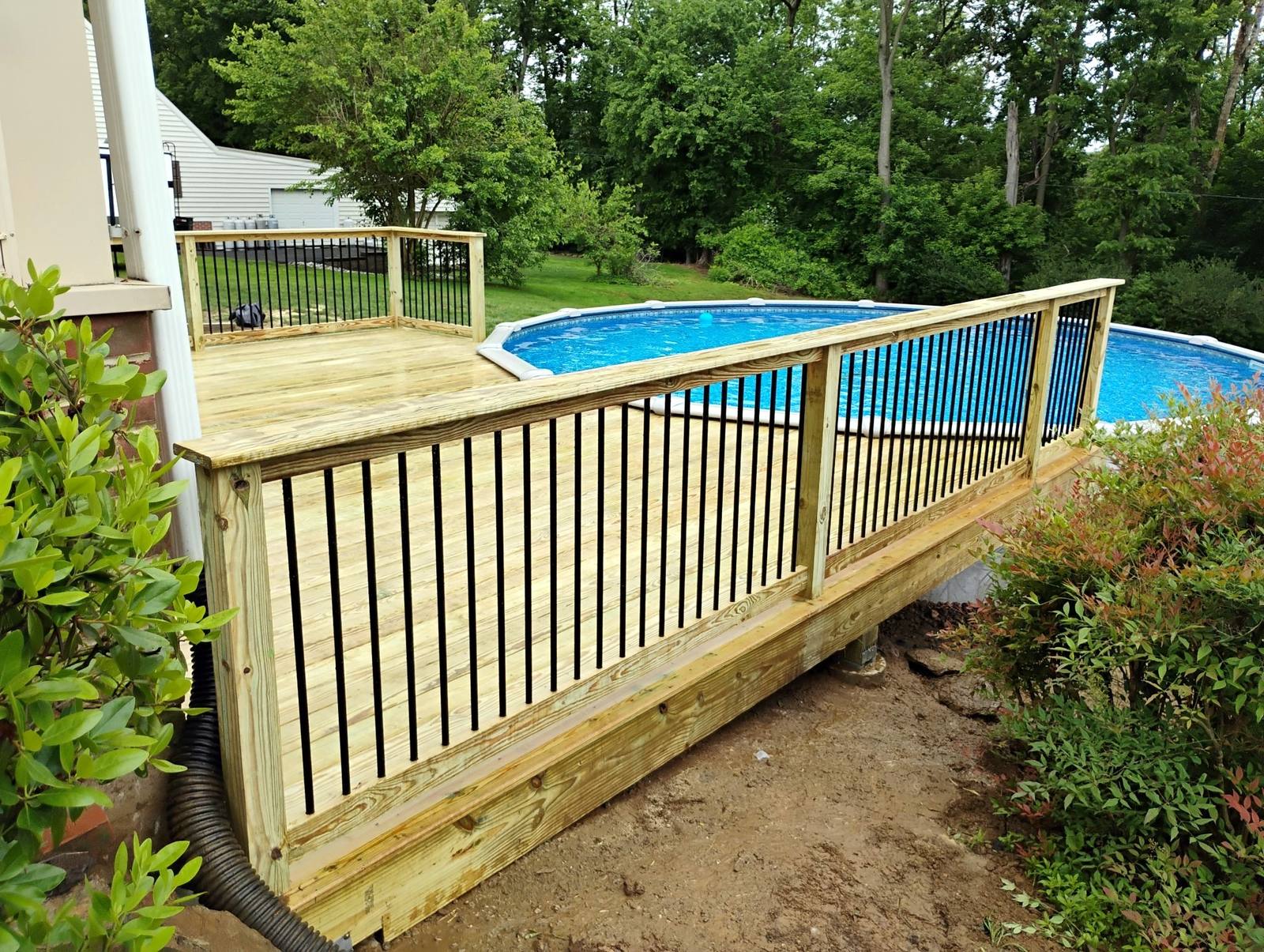 Finished pool deck stairs and safety railing