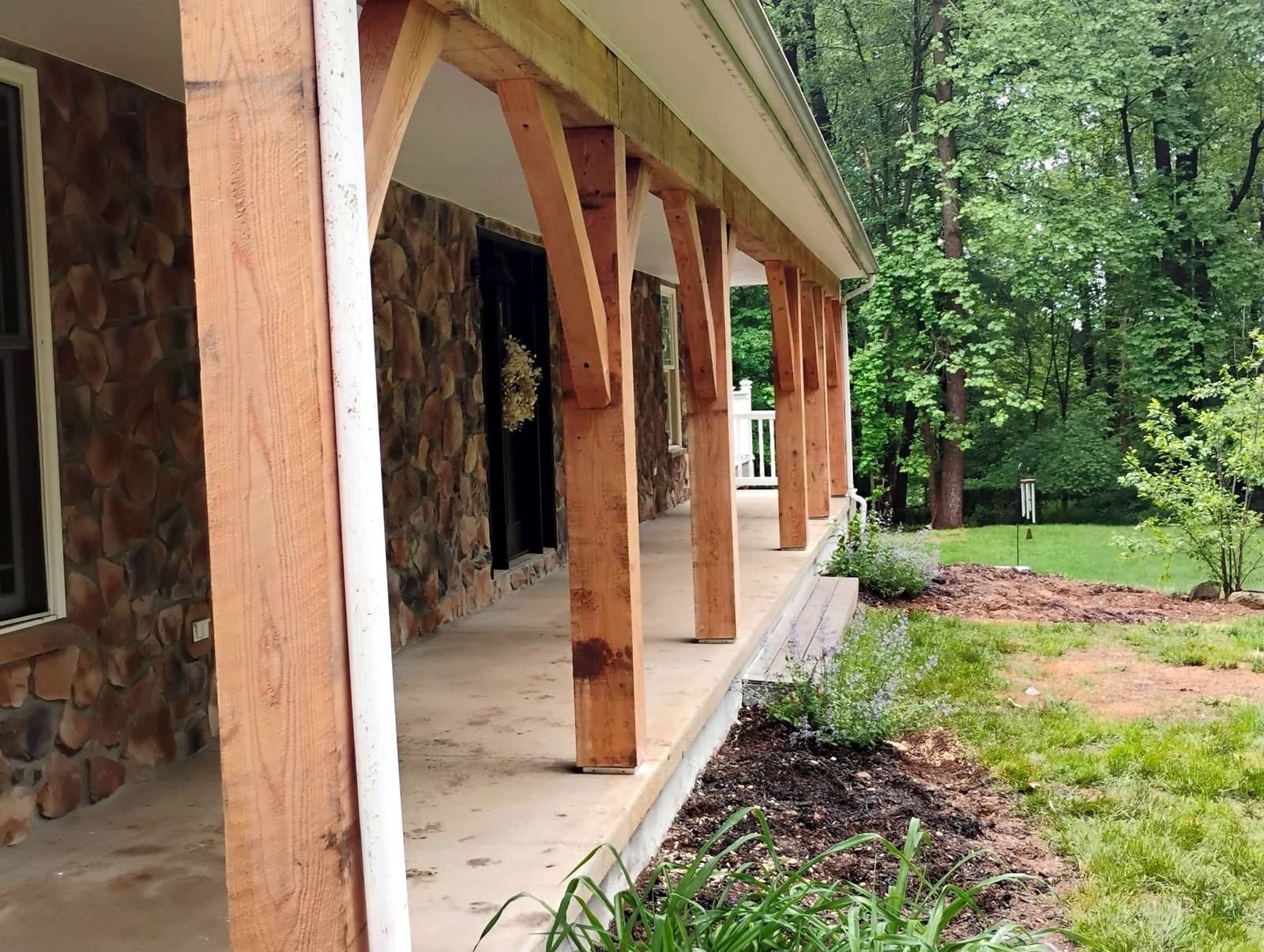 Covered porch framing and stone exterior detail