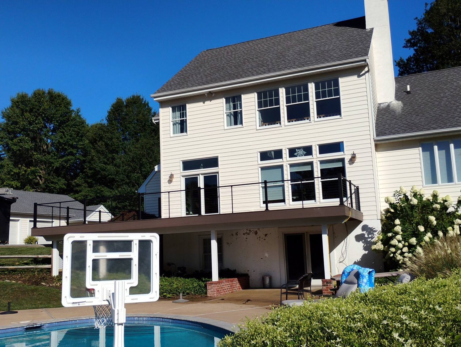 Completed two-story home with raised rear deck