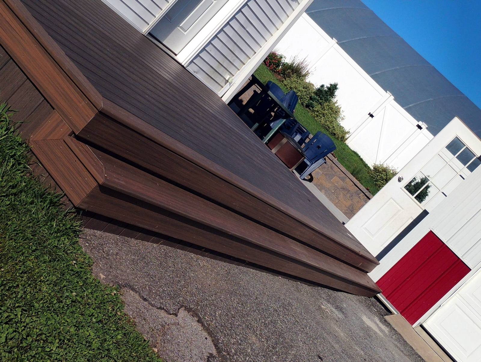 Brown composite deck stairs with finished skirting