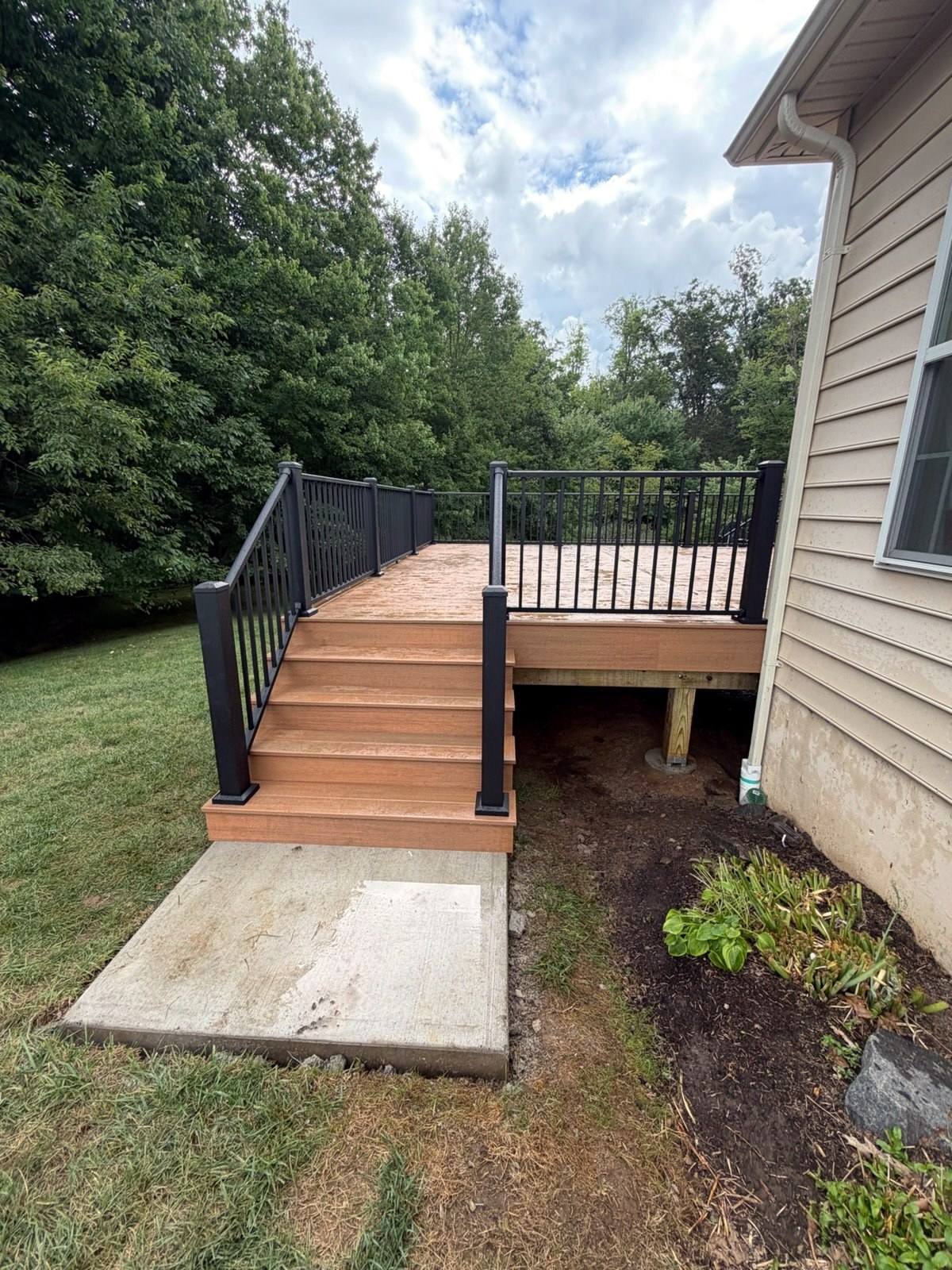 Completed brown deck with black metal railings