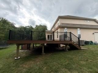 Completed raised deck beside a two-story home